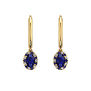 Gold blue sapphire oval halo hoop earrings front view