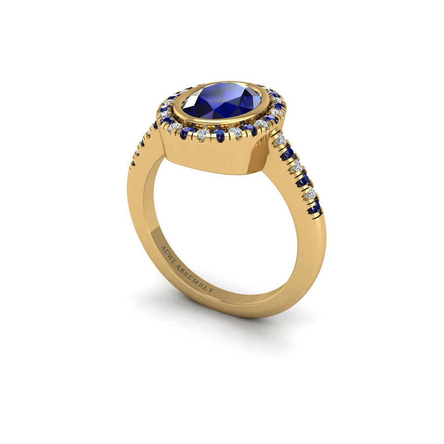 Gold blue sapphire oval halo ring