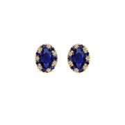 Gold blue sapphire oval halo stud earrings front view