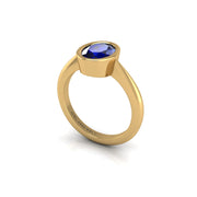 Gold blue sapphire oval solitaire ring