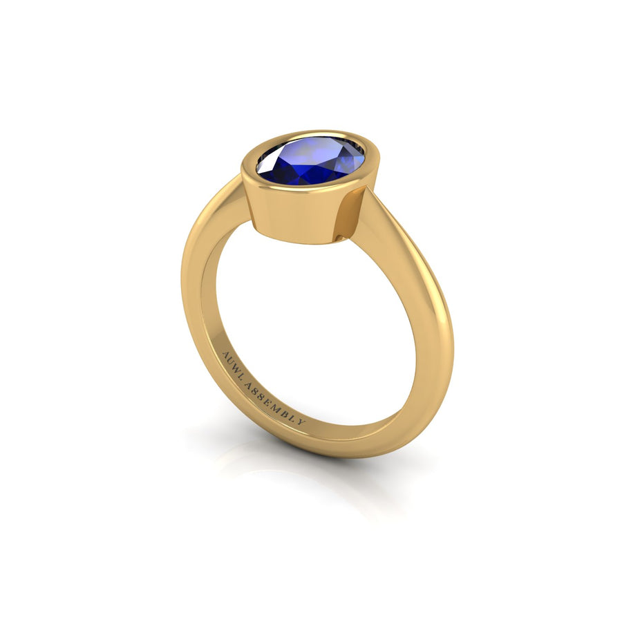 Gold blue sapphire oval solitaire ring