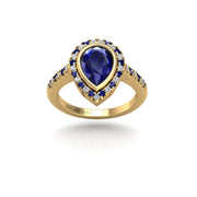 Gold blue sapphire pear halo ring front view
