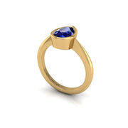 Gold blue sapphire pear solitaire ring
