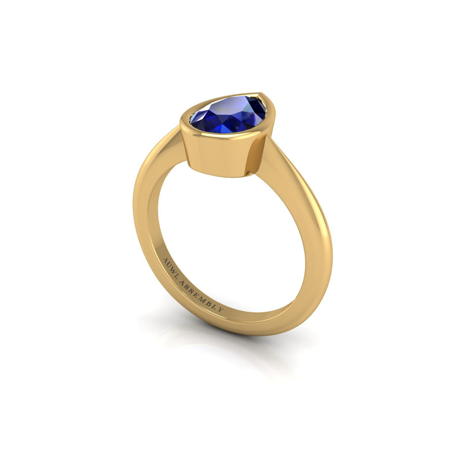 Gold blue sapphire pear solitaire ring