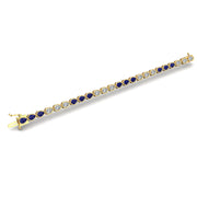 Gold blue sapphire stellar tennis bracelet open view
