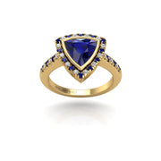 Gold blue sapphire trillion halo ring front view