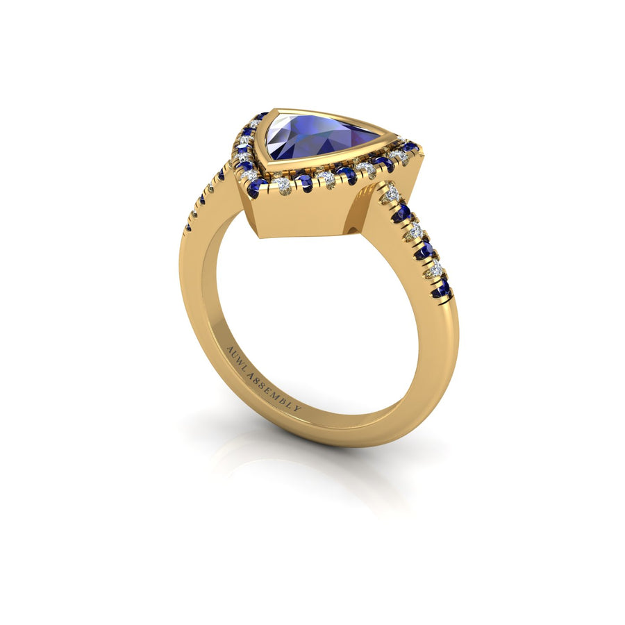 Gold blue sapphire trillion halo ring