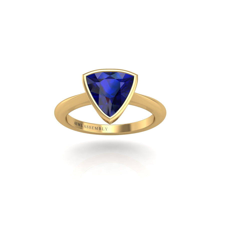 Gold blue sapphire trillion solitaire ring front view