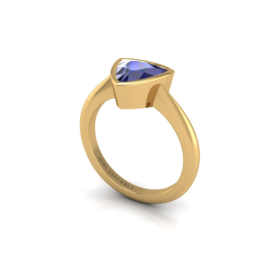 Gold blue sapphire trillion solitaire ring