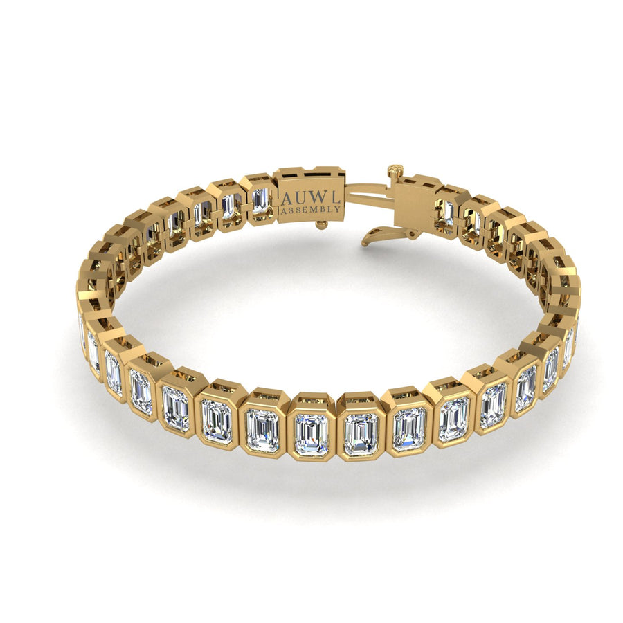 Gold diamond emerald stellar tennis bracelet