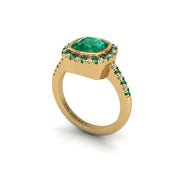 Gold emerald cushion halo ring