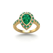 Gold emerald pear halo ring front view