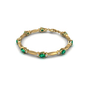 Gold emerald pear stardust designer bracelet