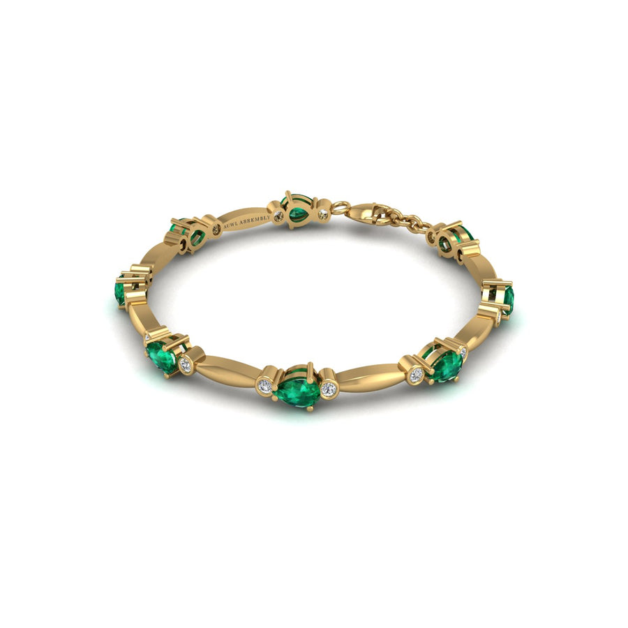 Gold emerald pear stardust designer bracelet
