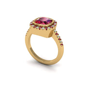Gold ruby cushion halo ring