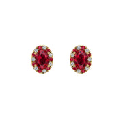 Gold ruby oval halo stud earrings front view