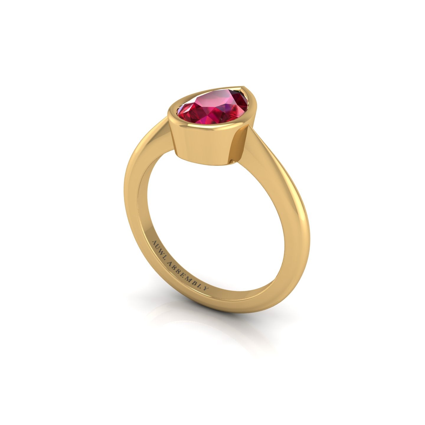 Gold ruby pear solitaire ring
