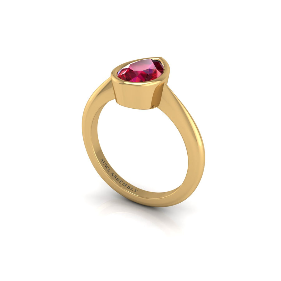 Gold ruby pear solitaire ring