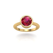 Gold ruby round solitaire ring front view