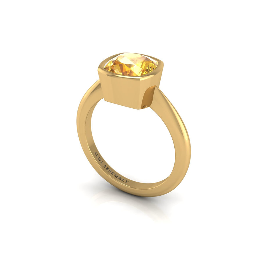 Gold yellow sapphire cushion solitaire ring